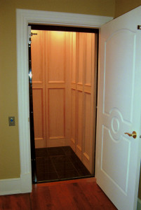 Home elevator with a light curtain